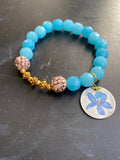 Bright Blue Glass Beads with Carved Wood Tin Charm Bracelet