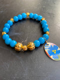 Bright Blue Bead with Silver Bead and Floral Tin Charm Bracelet