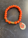 Orange Glass and Gold Bead and Floral Tin Charm Bracelet