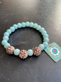 Light Blue Glass Beads with Carved Wooden Bead Tin Charm Bracelet