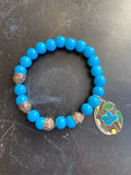 Bright Blue Glass Beads with Antiqued Silver Tin Charm Bracelet