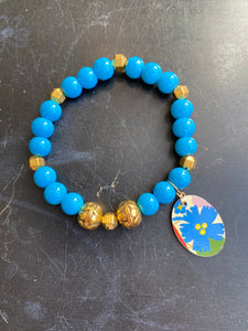 Bright Blue Bead with Silver Bead and Floral Tin Charm Bracelet